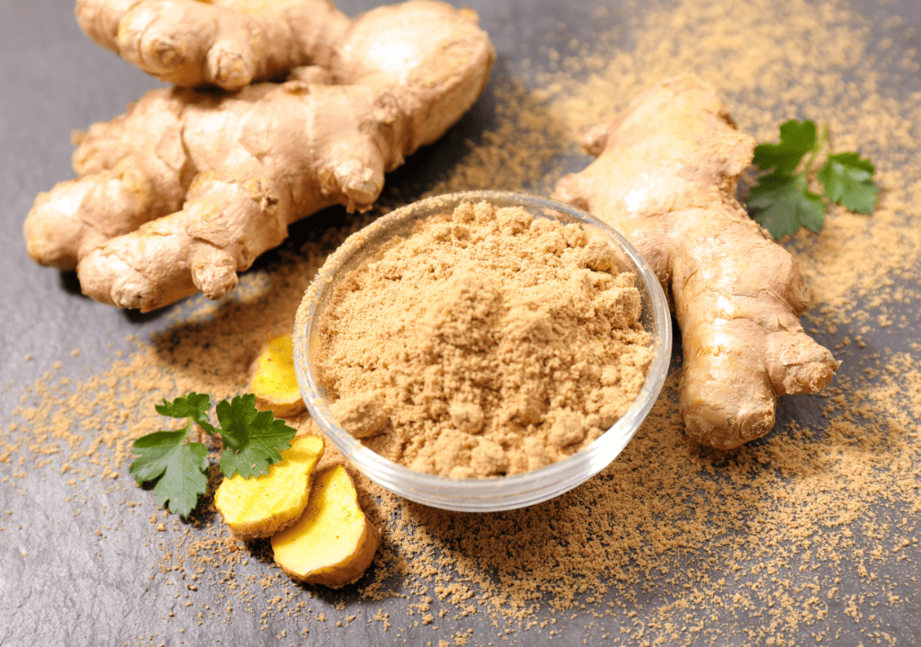 Fresh ginger and powdered ginger in a bowl