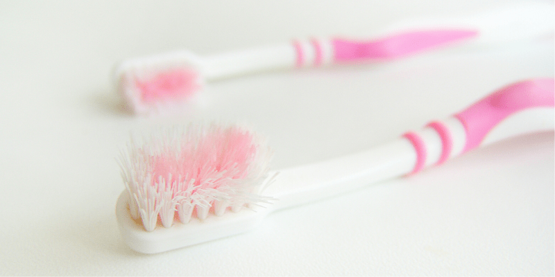 Old toothbrush to use for cleaning kitchen cabinets