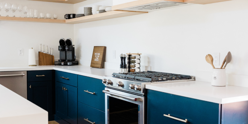 Blue-painted-cabinets-showing-off-oven-range