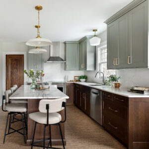 Beautiful kitchen in natural Cherry stain wood colour and calm Sage green