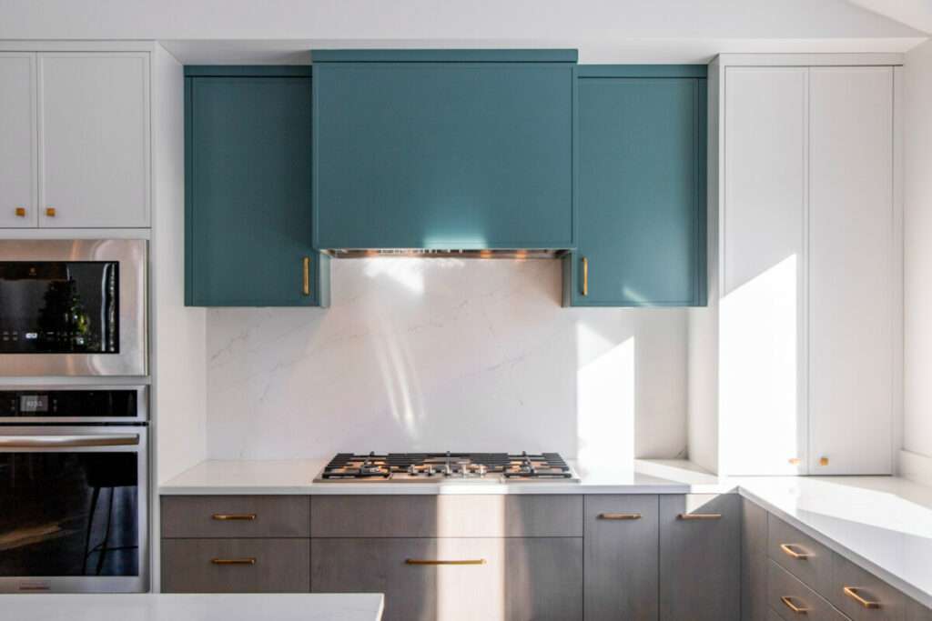 Mint Green Kitchen Cabinets Add A Colorful Element To This Home Addition