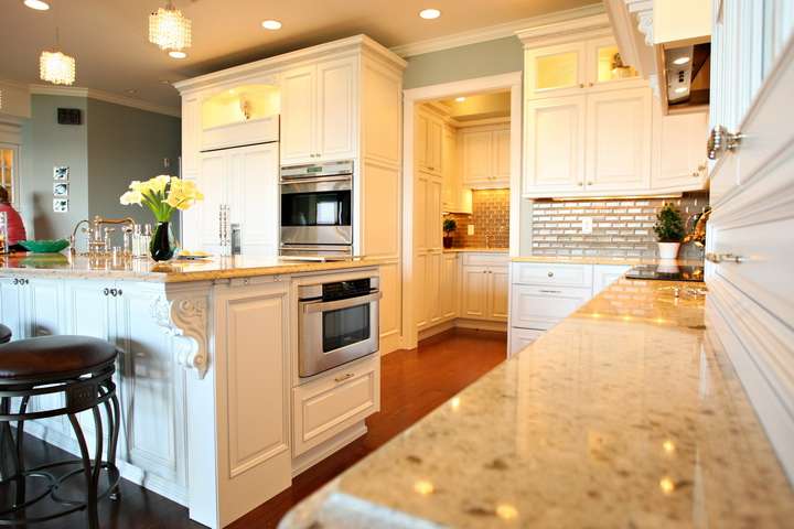 white cabinets with corbels