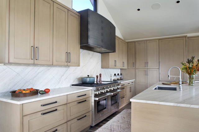 wood cabinets with white countertops