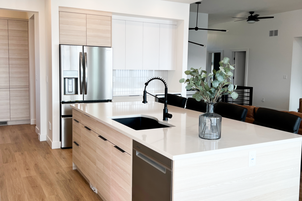 wood cabinets with white countertops