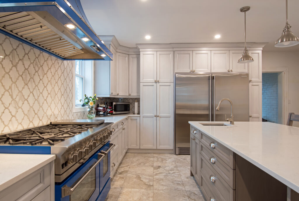 kitchen with blue stove and range hood