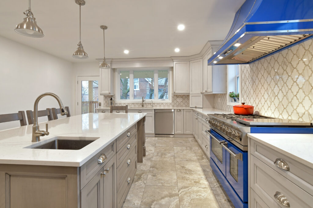 kitchen with blue stove and range hood