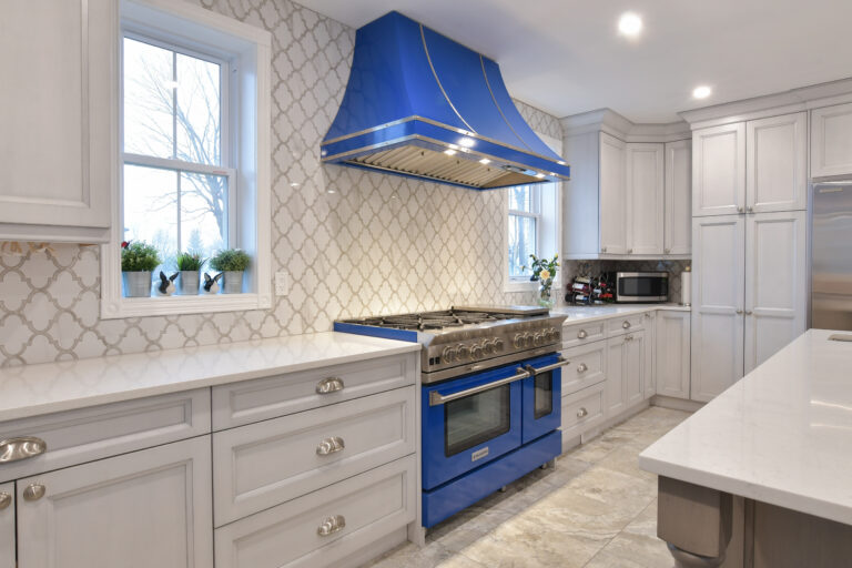 kitchen with blue stove and range hood