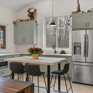 Sage-green Melamine and Knotty Alder kitchen