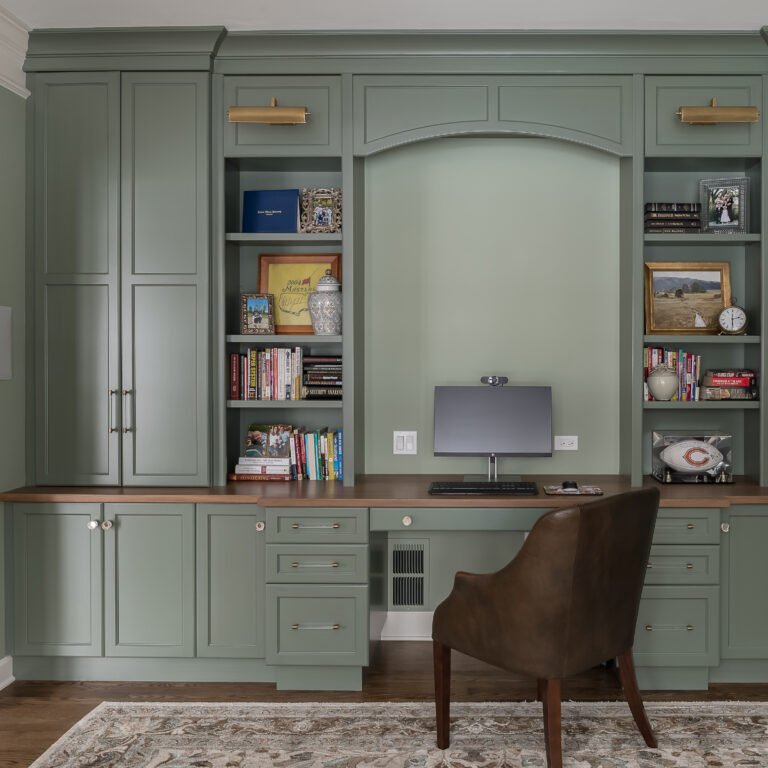 Moody deep-green office space in Maple and Walnut materials.
