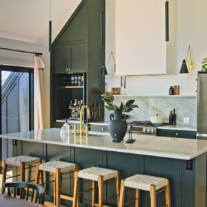 Creative Cathedral Ceiling Kitchen in white and green shades.