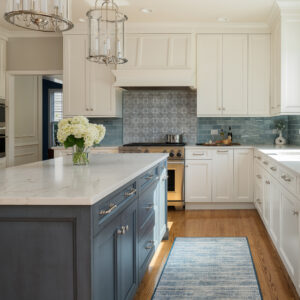 Stunning white kitchen with grey-blue Reef colour island