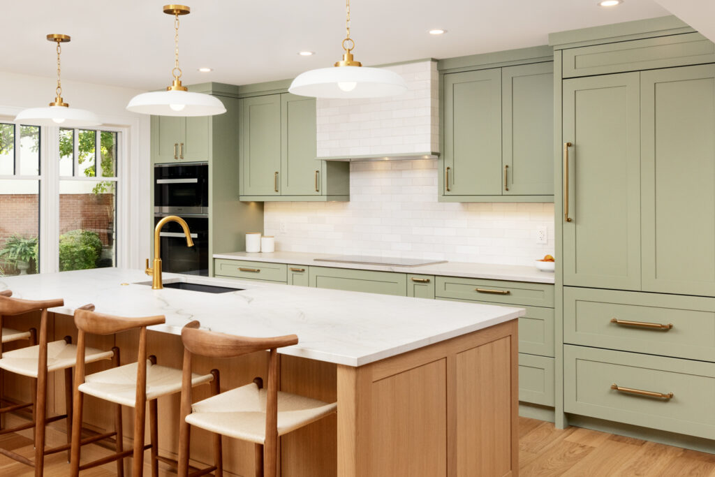 how to choose a kitchen backsplash like a designer showing green cabinets and tile backsplash